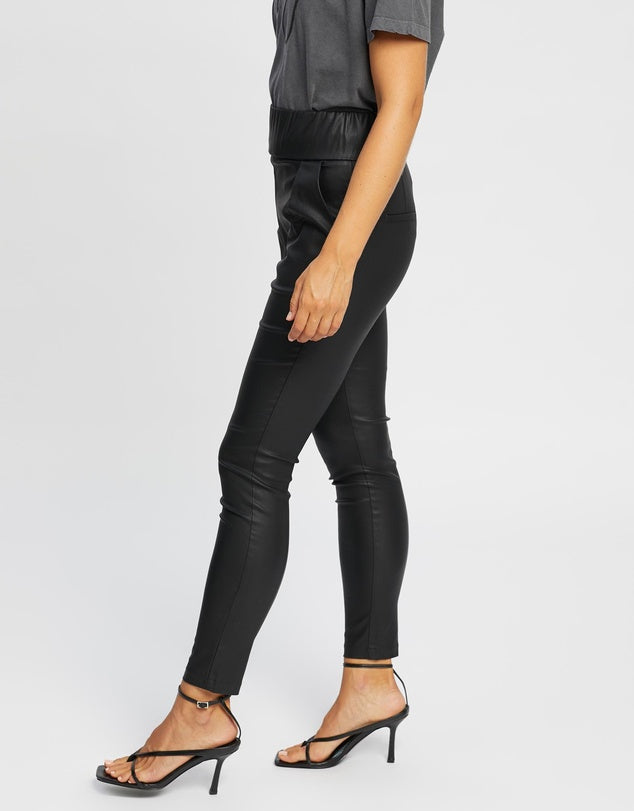 PANT ALEXA JORGE BLACK - Sheen finish leatherette; minimal stretch; unlined; opaque - Ruched elastic waistband; zip-through rear entry - Darted pleats front and rear for tailored look - Two functional slash hip pockets and two rear seamed pockets LADIES DRESS PANTS